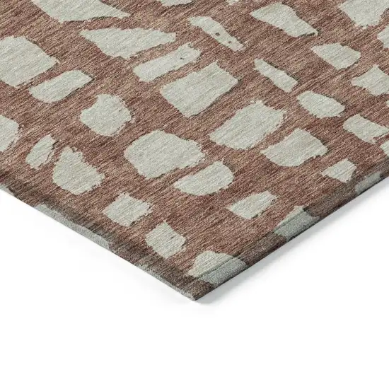 Orange And Ivory Abstract Washable Indoor Outdoor Area Rug Photo 3