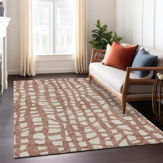 Orange And Ivory Abstract Washable Indoor Outdoor Area Rug Photo 8