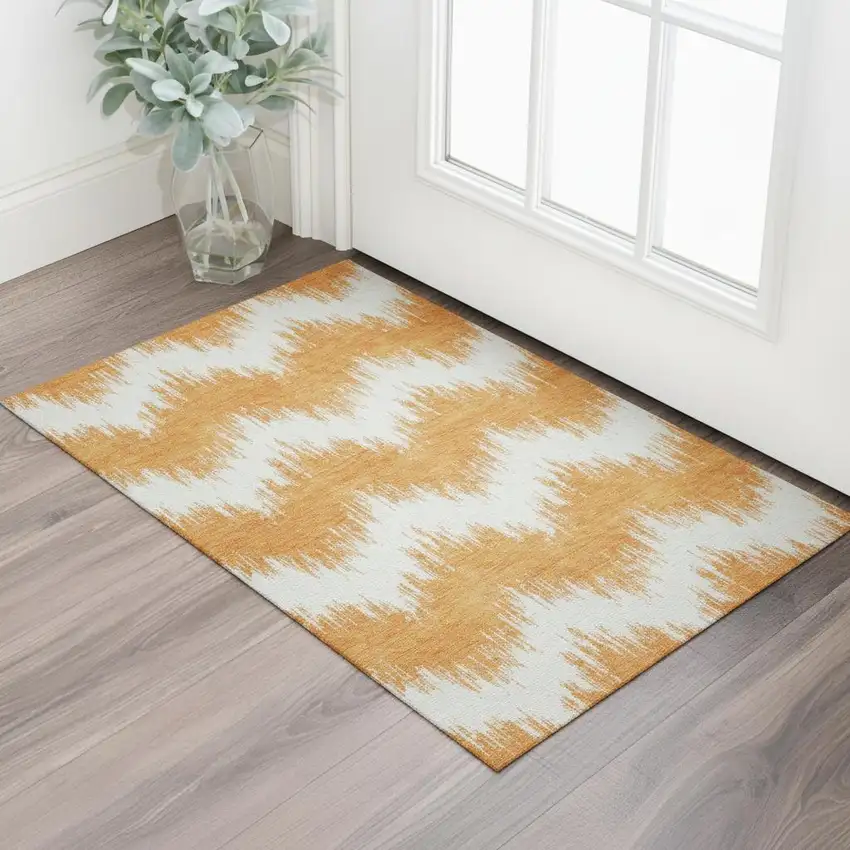 Orange And Ivory Chevron Washable Area Rug With UV Protection Photo 1
