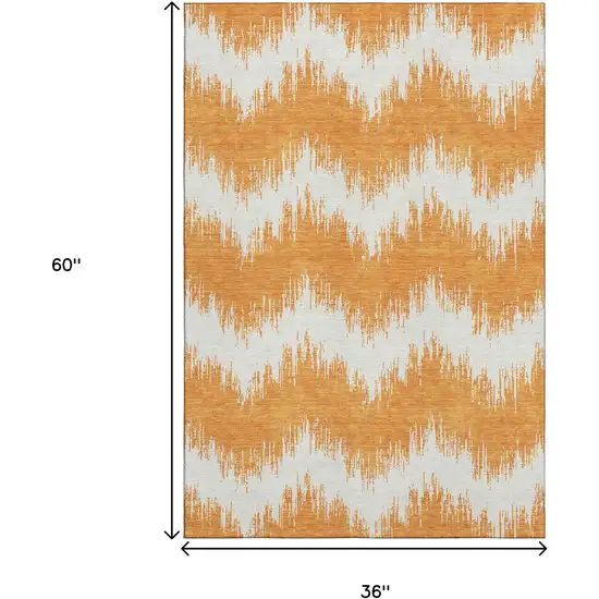 Orange And Ivory Chevron Washable Area Rug With UV Protection Photo 3