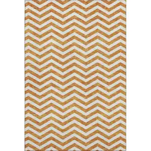 Photo of Orange And Ivory Chevron Washable Area Rug With UV Protection
