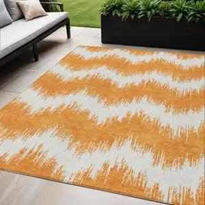Photo of Orange And Ivory Chevron Washable Indoor Outdoor Area Rug