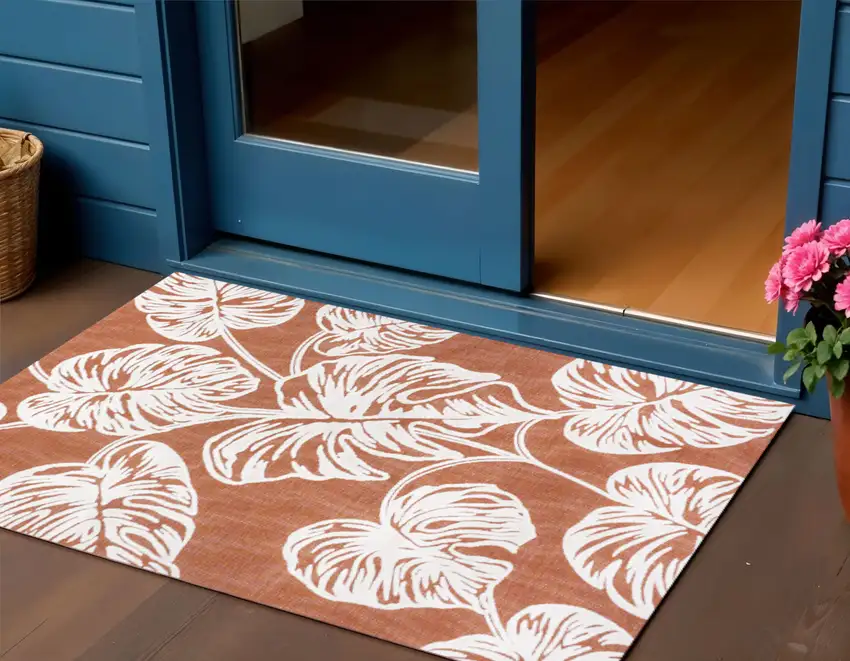Orange And Ivory Floral Indoor Outdoor Area Rug Photo 1