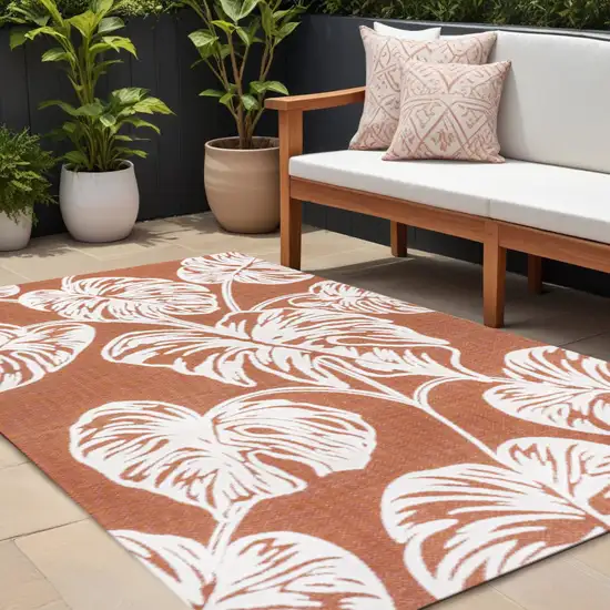 Orange And Ivory Floral Indoor Outdoor Area Rug Photo 1