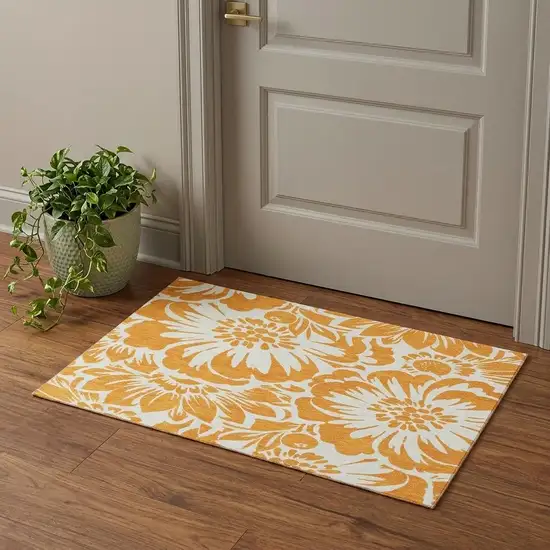 Orange And Ivory Floral Washable Area Rug With UV Protection Photo 1