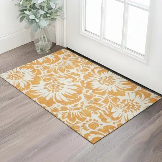 Orange And Ivory Floral Washable Area Rug With UV Protection Photo 1