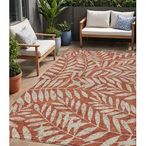 Photo of Orange And Ivory Floral Washable Indoor Outdoor Area Rug