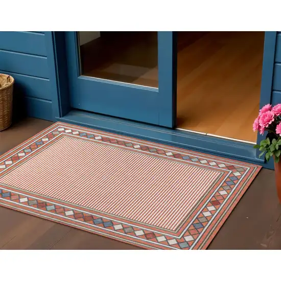 Orange And Ivory Geometric Indoor Outdoor Area Rug Photo 1