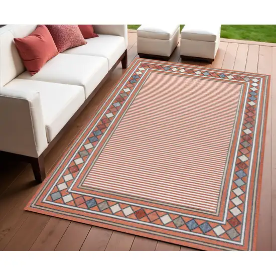 Orange And Ivory Geometric Indoor Outdoor Area Rug Photo 1
