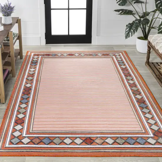 Orange And Ivory Geometric Indoor Outdoor Area Rug Photo 7