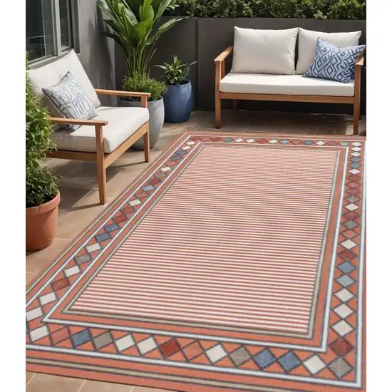 Orange And Ivory Geometric Indoor Outdoor Area Rug Photo 1