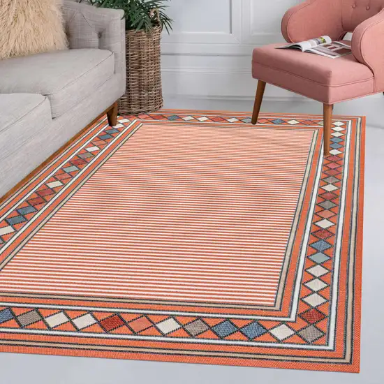 Orange And Ivory Geometric Indoor Outdoor Area Rug Photo 9