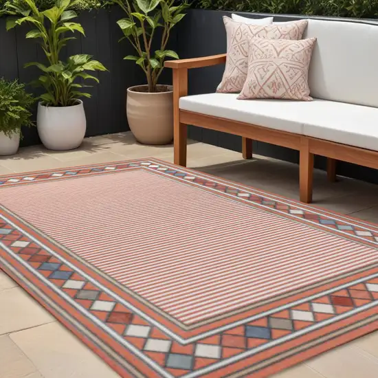 Orange And Ivory Geometric Indoor Outdoor Area Rug Photo 1