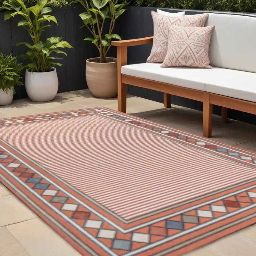 Orange And Ivory Geometric Indoor Outdoor Area Rug Photo 1