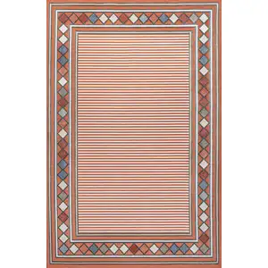 Photo of Orange And Ivory Geometric Indoor Outdoor Area Rug