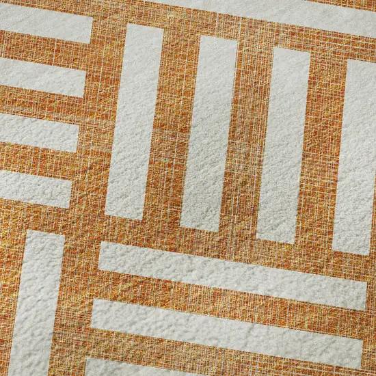 Orange And Ivory Geometric Washable Area Rug With UV Protection Photo 1