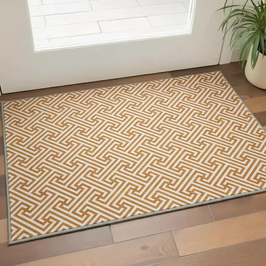 Orange And Ivory Geometric Washable Area Rug With UV Protection Photo 2