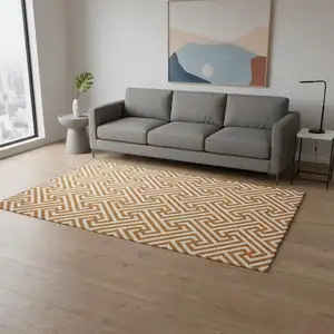 Photo of Orange And Ivory Geometric Washable Area Rug With UV Protection