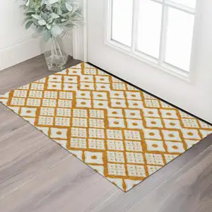 Photo of Orange And Ivory Geometric Washable Area Rug With UV Protection