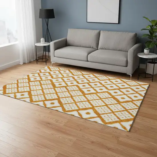 Orange And Ivory Geometric Washable Area Rug With UV Protection Photo 1