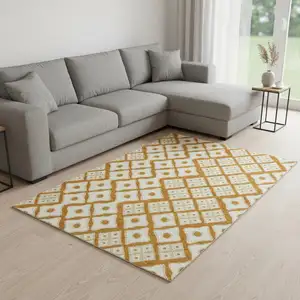 Photo of Orange And Ivory Geometric Washable Area Rug With UV Protection