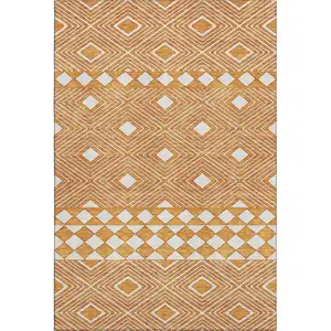 Photo of Orange And Ivory Geometric Washable Area Rug With UV Protection