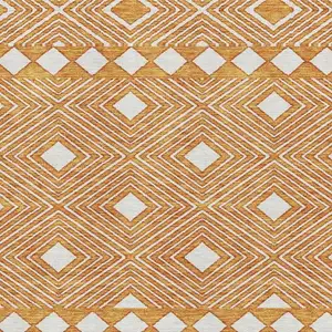 Photo of Orange And Ivory Geometric Washable Area Rug With UV Protection