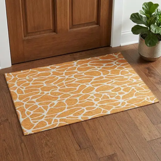 Orange And Ivory Geometric Washable Area Rug With UV Protection Photo 1