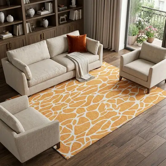 Orange And Ivory Geometric Washable Area Rug With UV Protection Photo 1