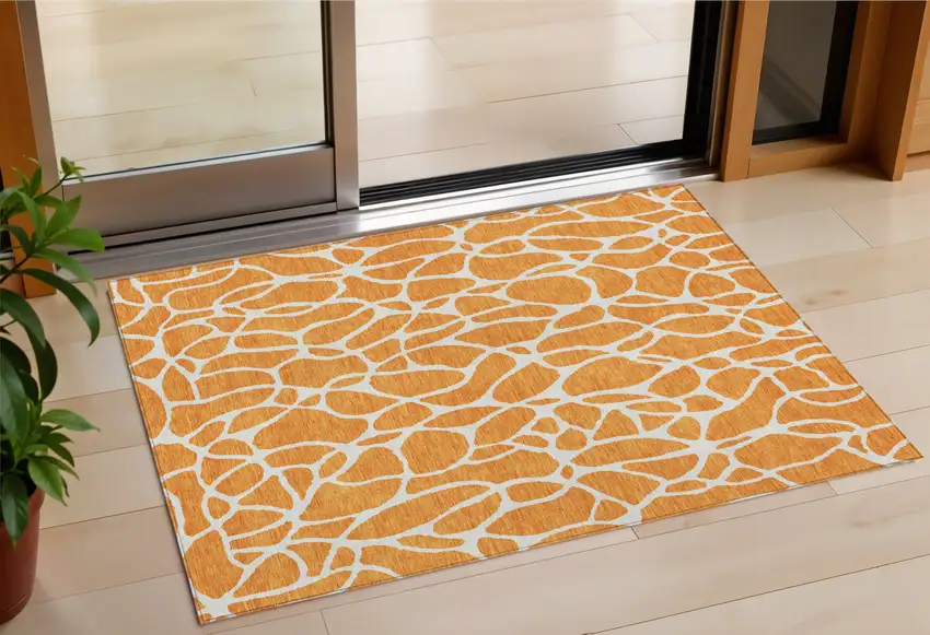Orange And Ivory Geometric Washable Indoor Outdoor Area Rug Photo 1