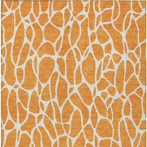 Photo of Orange And Ivory Geometric Washable Indoor Outdoor Area Rug