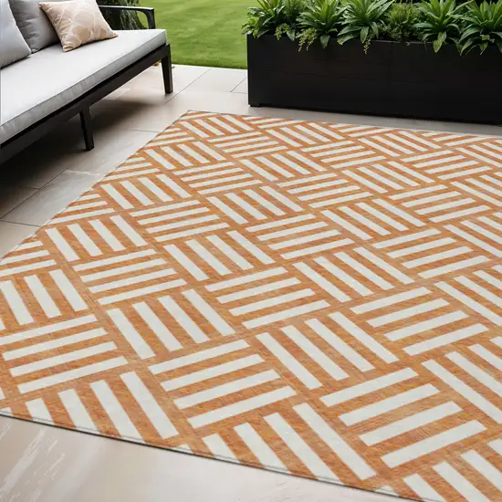 Orange And Ivory Geometric Washable Indoor Outdoor Area Rug Photo 1