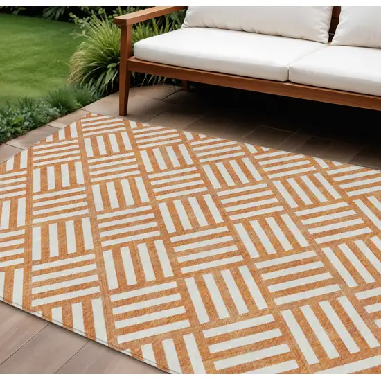 Orange And Ivory Geometric Washable Indoor Outdoor Area Rug Photo 1