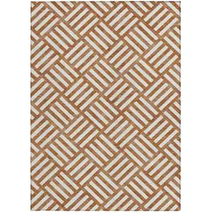 Photo of Orange And Ivory Geometric Washable Indoor Outdoor Area Rug