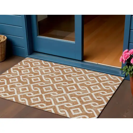 Orange And Ivory Geometric Washable Indoor Outdoor Area Rug Photo 1