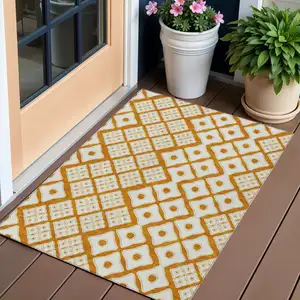 Photo of Orange And Ivory Geometric Washable Indoor Outdoor Area Rug