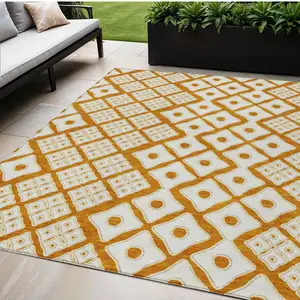 Photo of Orange And Ivory Geometric Washable Indoor Outdoor Area Rug