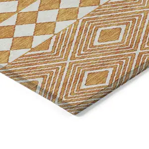 Photo of Orange And Ivory Geometric Washable Indoor Outdoor Area Rug