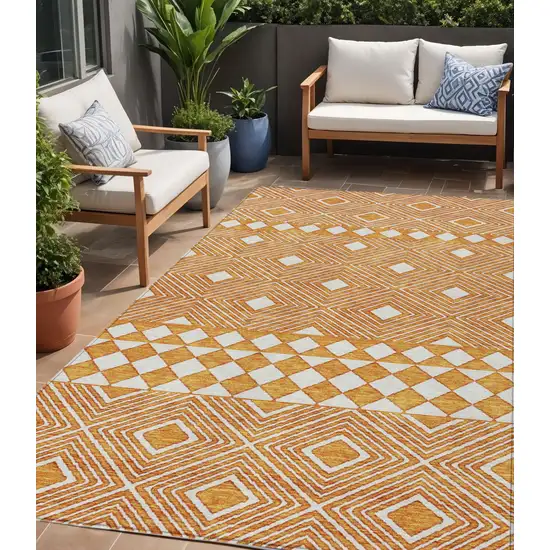 Orange And Ivory Geometric Washable Indoor Outdoor Area Rug Photo 1