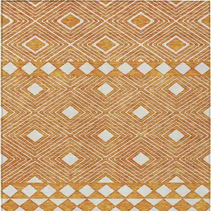 Photo of Orange And Ivory Geometric Washable Indoor Outdoor Area Rug
