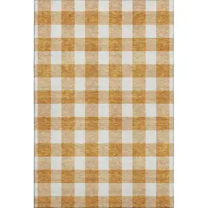 Photo of Orange And Ivory Plaid Washable Area Rug With UV Protection