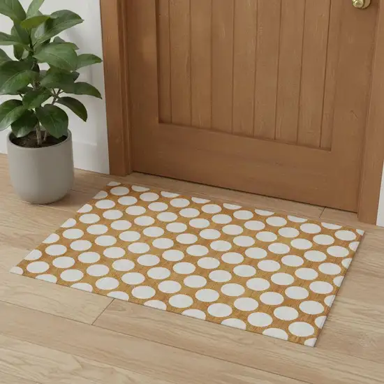 Orange And Ivory Polka Dot Washable Area Rug With UV Protection Photo 1