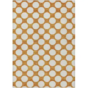 Photo of Orange And Ivory Polka Dot Washable Indoor Outdoor Area Rug