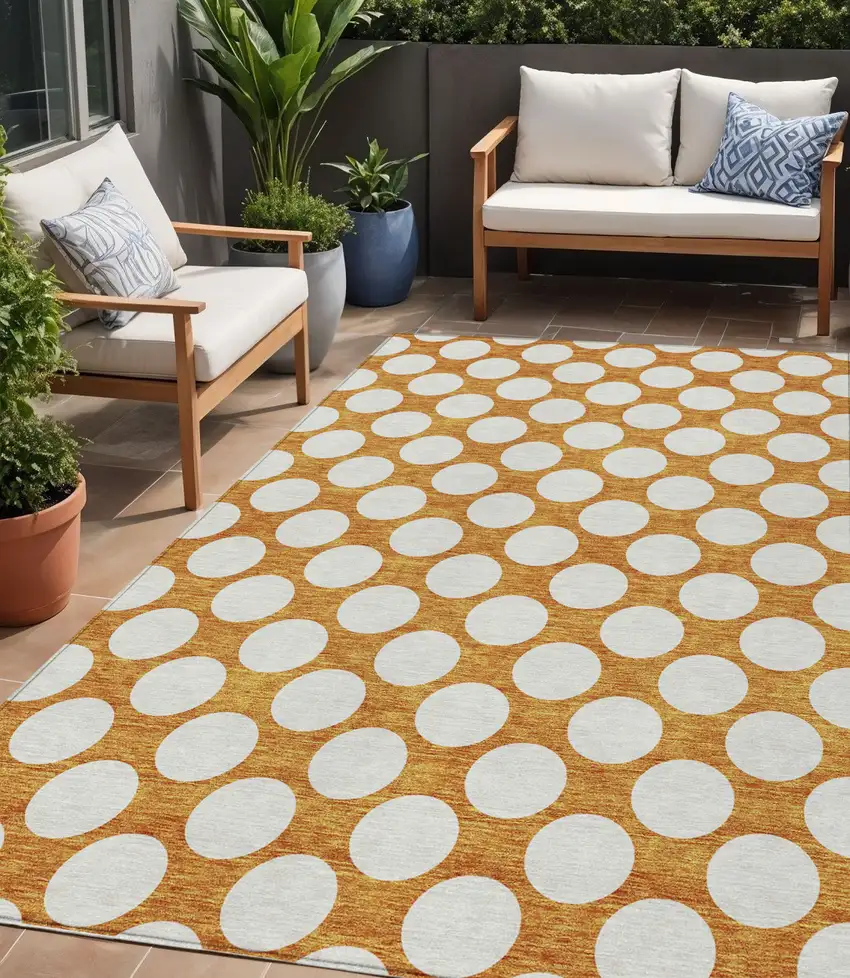 Orange And Ivory Polka Dot Washable Indoor Outdoor Area Rug Photo 1