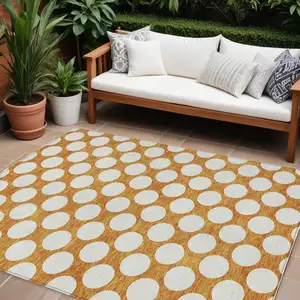 Photo of Orange And Ivory Polka Dot Washable Indoor Outdoor Area Rug