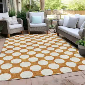 Photo of Orange And Ivory Polka Dot Washable Indoor Outdoor Area Rug