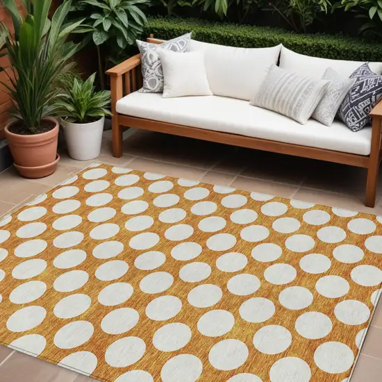 Orange And Ivory Polka Dot Washable Indoor Outdoor Area Rug Photo 1