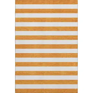 Photo of Orange And Ivory Striped Washable Area Rug With UV Protection