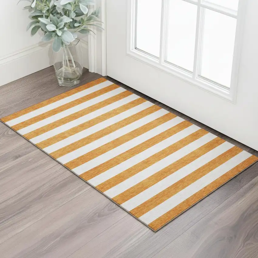 Orange And Ivory Striped Washable Area Rug With UV Protection Photo 1