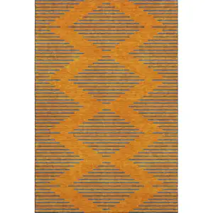 Photo of Orange And Navy Blue Geometric Washable Area Rug With UV Protection